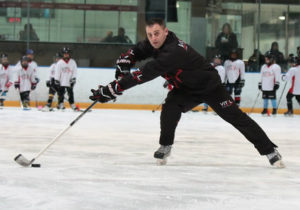 Jim Vitale demonstrating a backhand pass with reach and flexibility